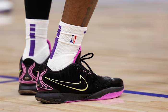 Los Angeles Lakers forward LeBron James' black and pink Nike sneakers.